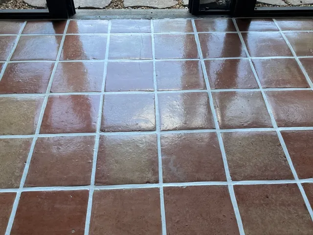 Restored Saltillo tile floor with glossy, even finish