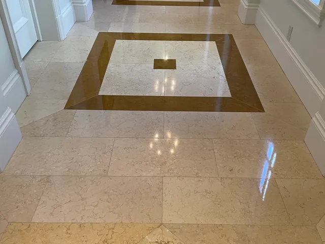 Polished marble floor with a decorative square inlay