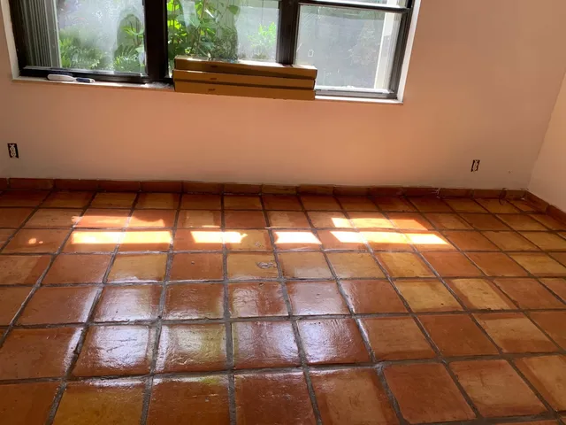 Sunlit room with restored Saltillo tile floor