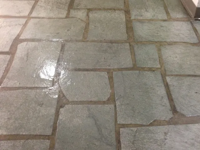 Flagstone patio with irregular stones after deep cleaning